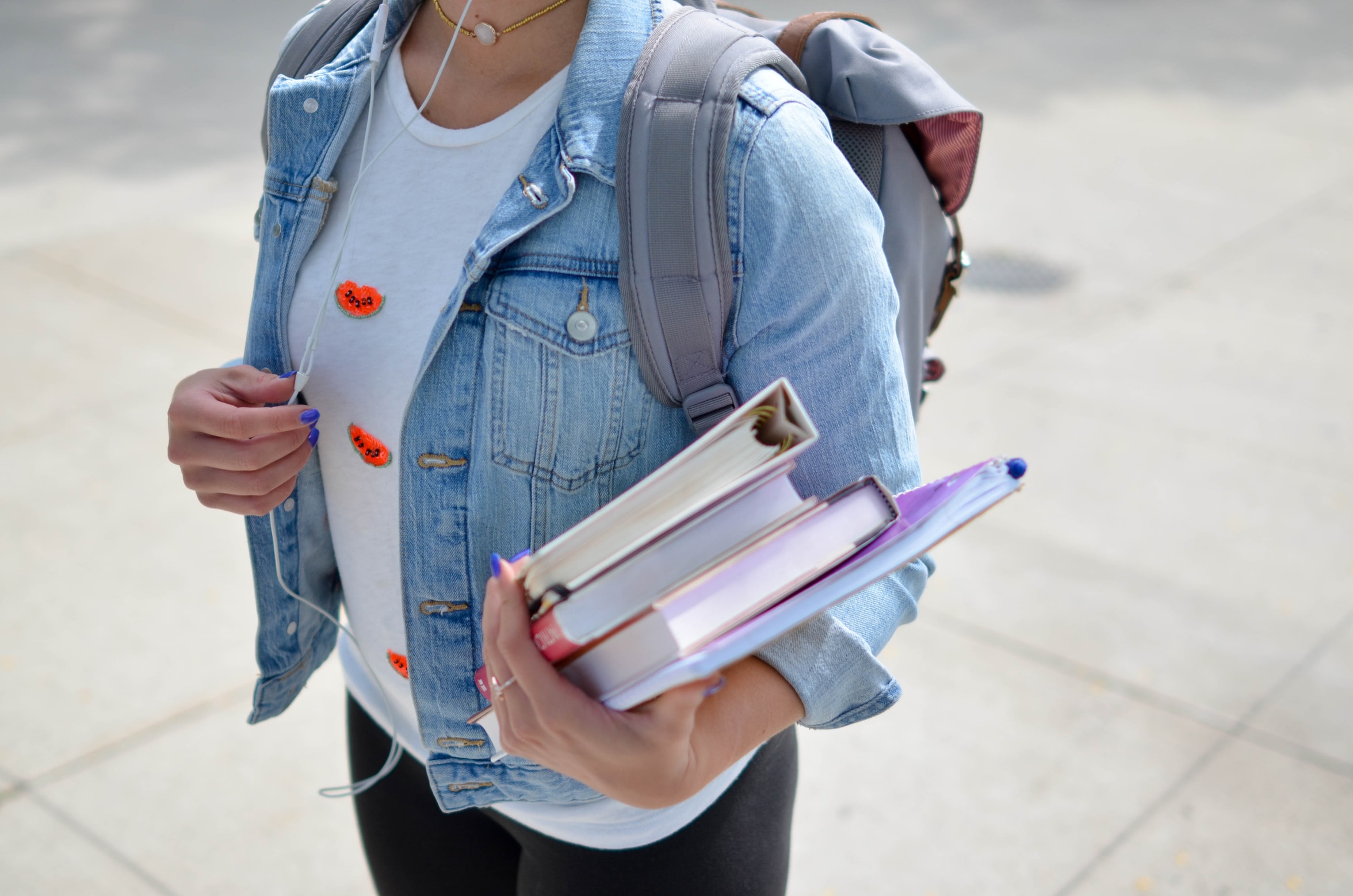 Female College Student Carrying Books