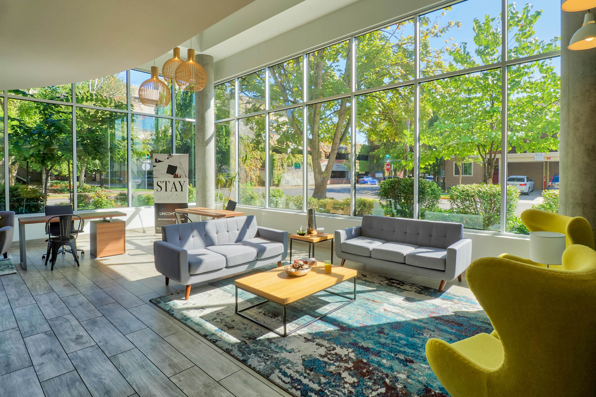 clubhouse area with tables and chairs at the soto apartments